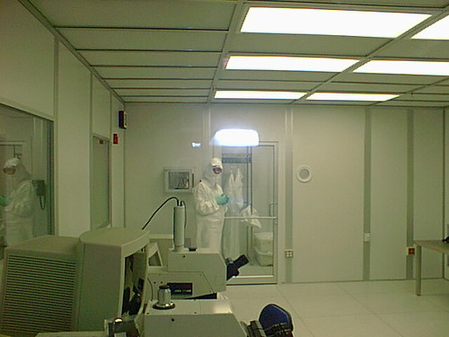 Staff in cleanroom gowns working in a laboratory cleanroom